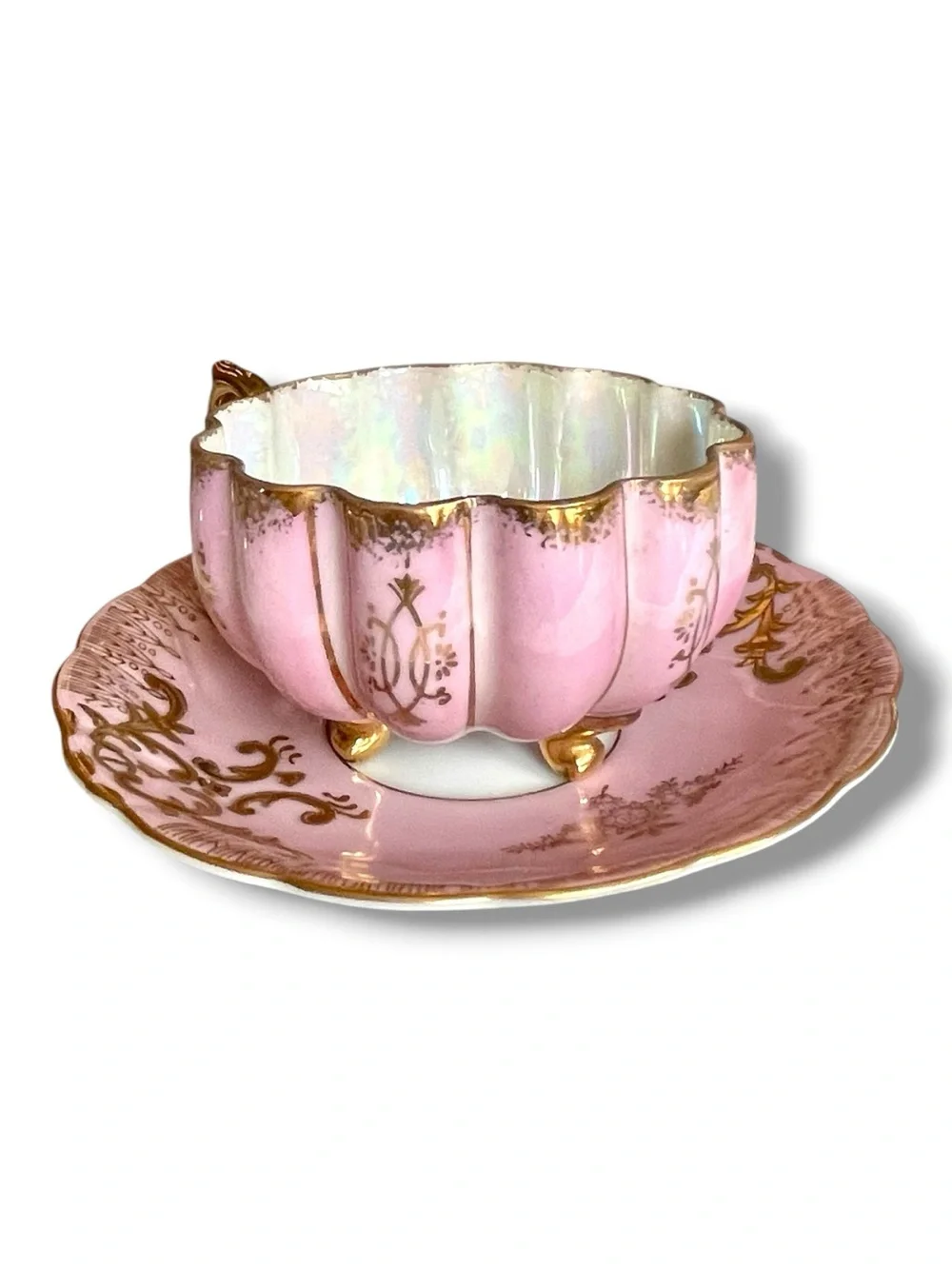 Lusterware teacup & saucer, melon shaped cup on 3 gilded feet, iridescent